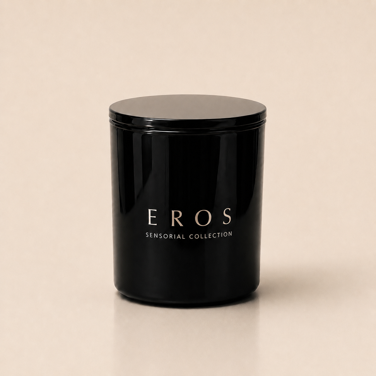 Flamma Hestia EROS luxury candle in a reusable black glass vessel, tonka oud and amber fragrance
