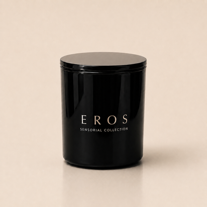 Flamma Hestia EROS luxury candle in a reusable black glass vessel, tonka oud and amber fragrance
