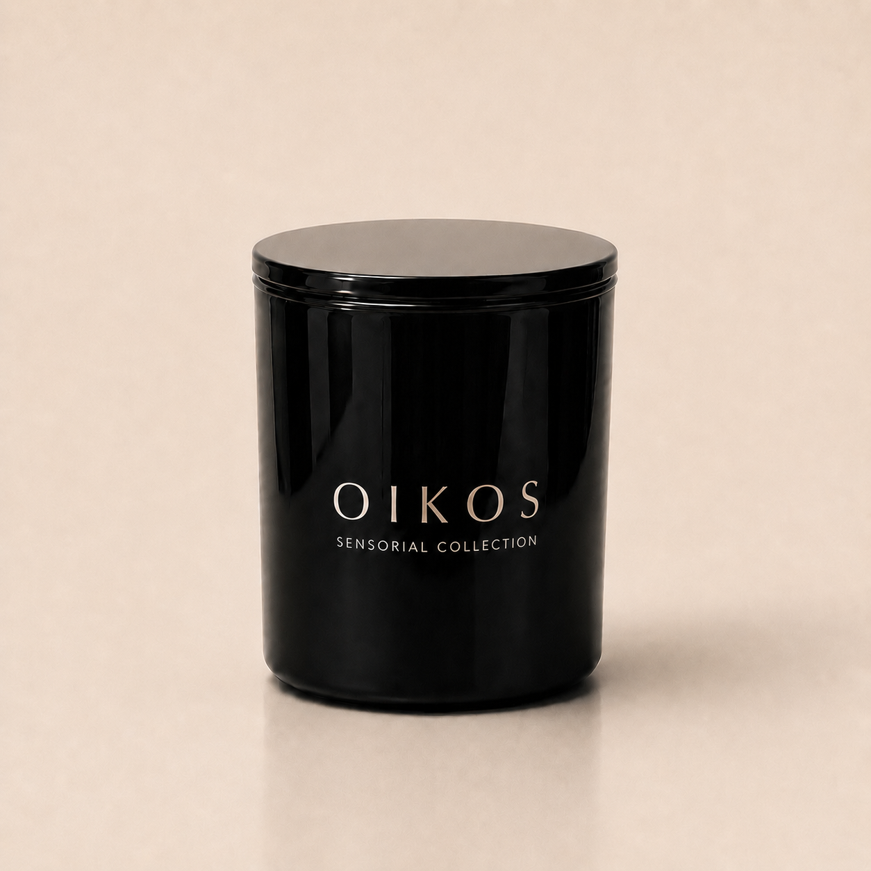 Flamma Hestia OIKOS luxury candle in a reusable black glass vessel, gardenia and vanilla fragrance