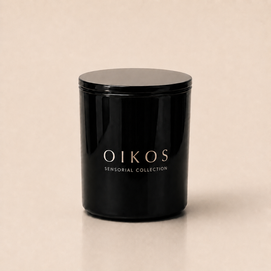 Flamma Hestia OIKOS luxury candle in a reusable black glass vessel, gardenia and vanilla fragrance