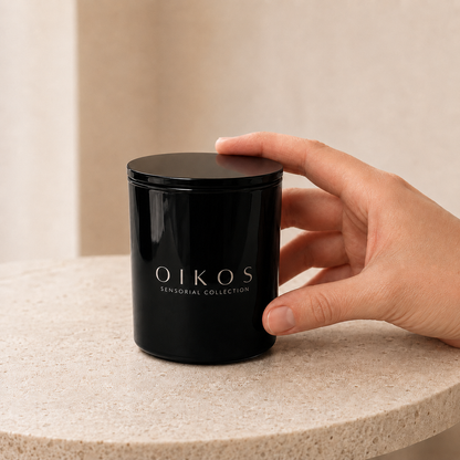 Flamma Hestia OIKOS candle beside its wax-sealed kraft paper packaging
